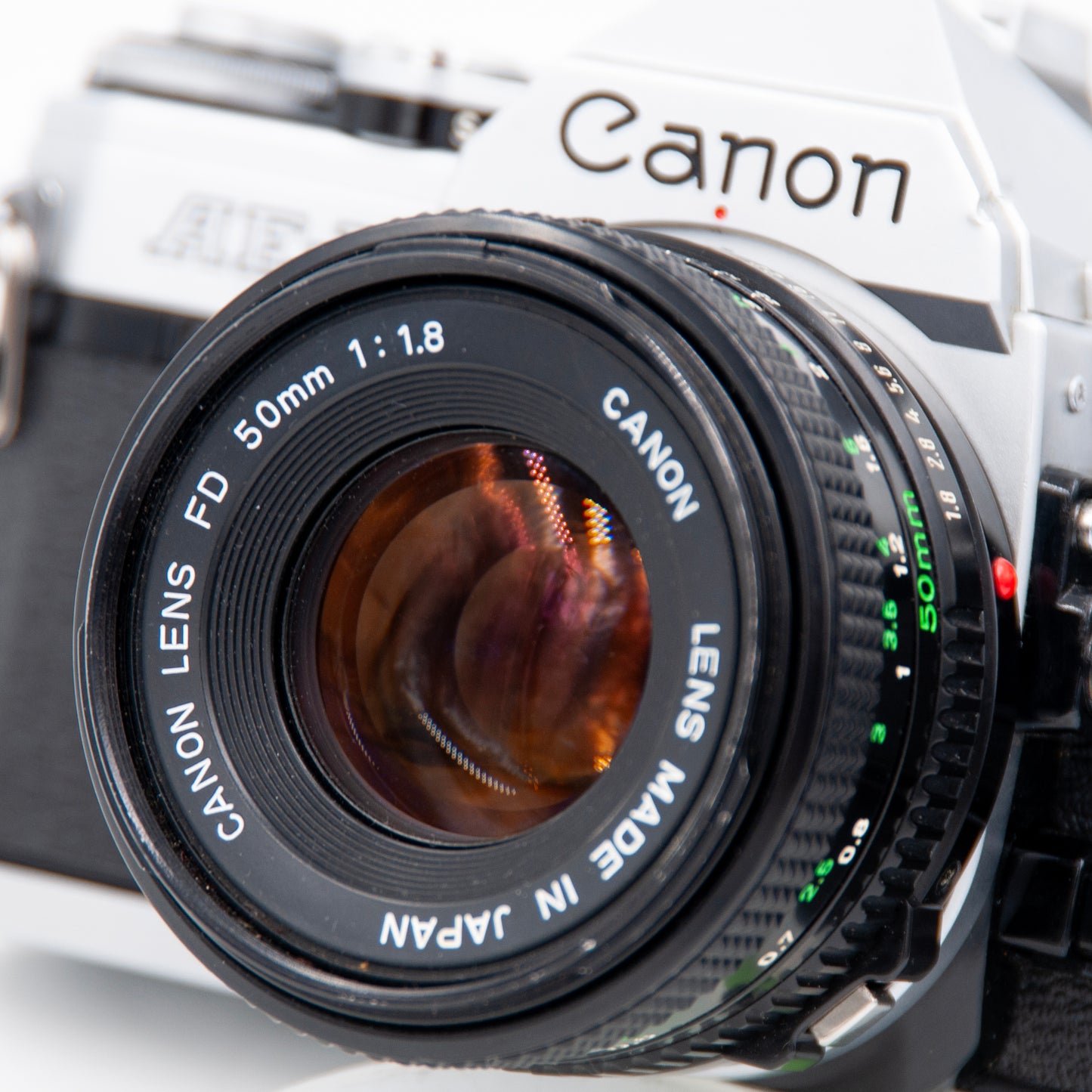 Close-up of Canon FD 50mm f1.8 lens on Canon AE-1 camera.